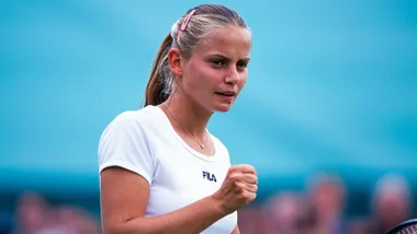 A photo of a young Jelena Dokic in a white t shirt with her blonde hair in a ponytail.
