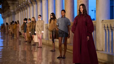 Models line up at the max mara resort 25 show.